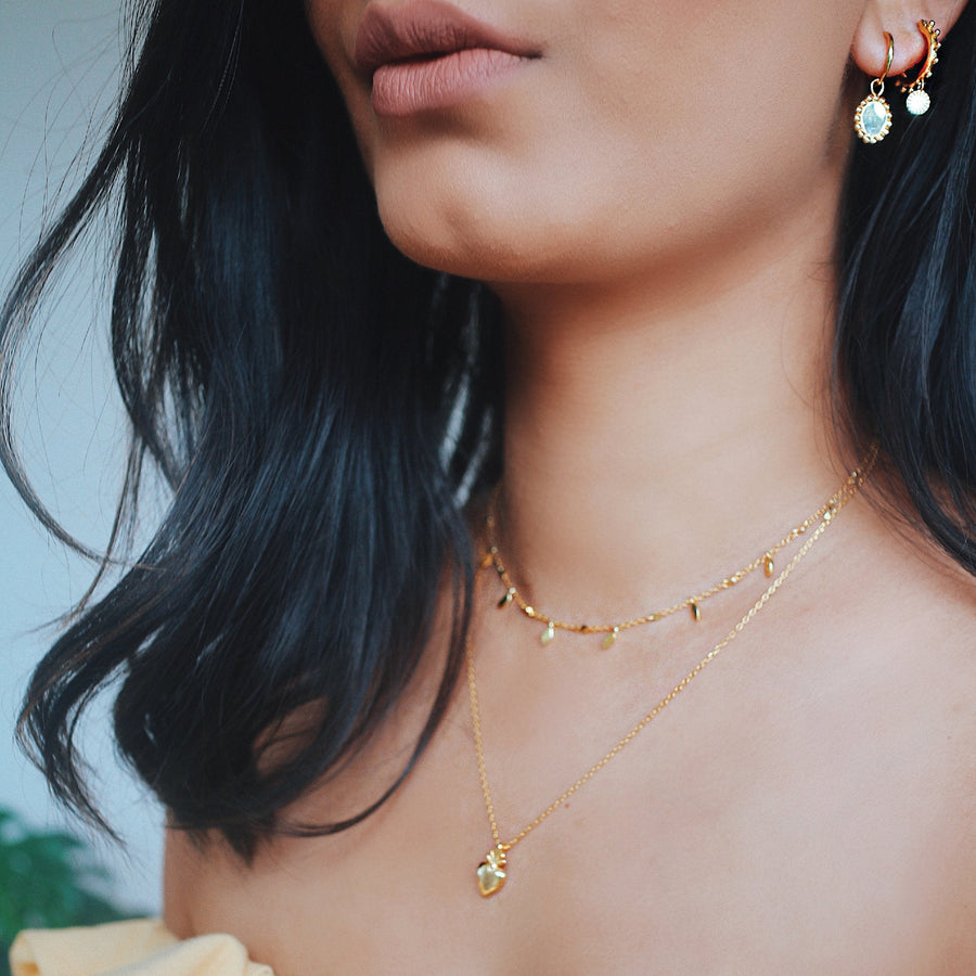 Gold over Sterling silver charm choker on model product photo