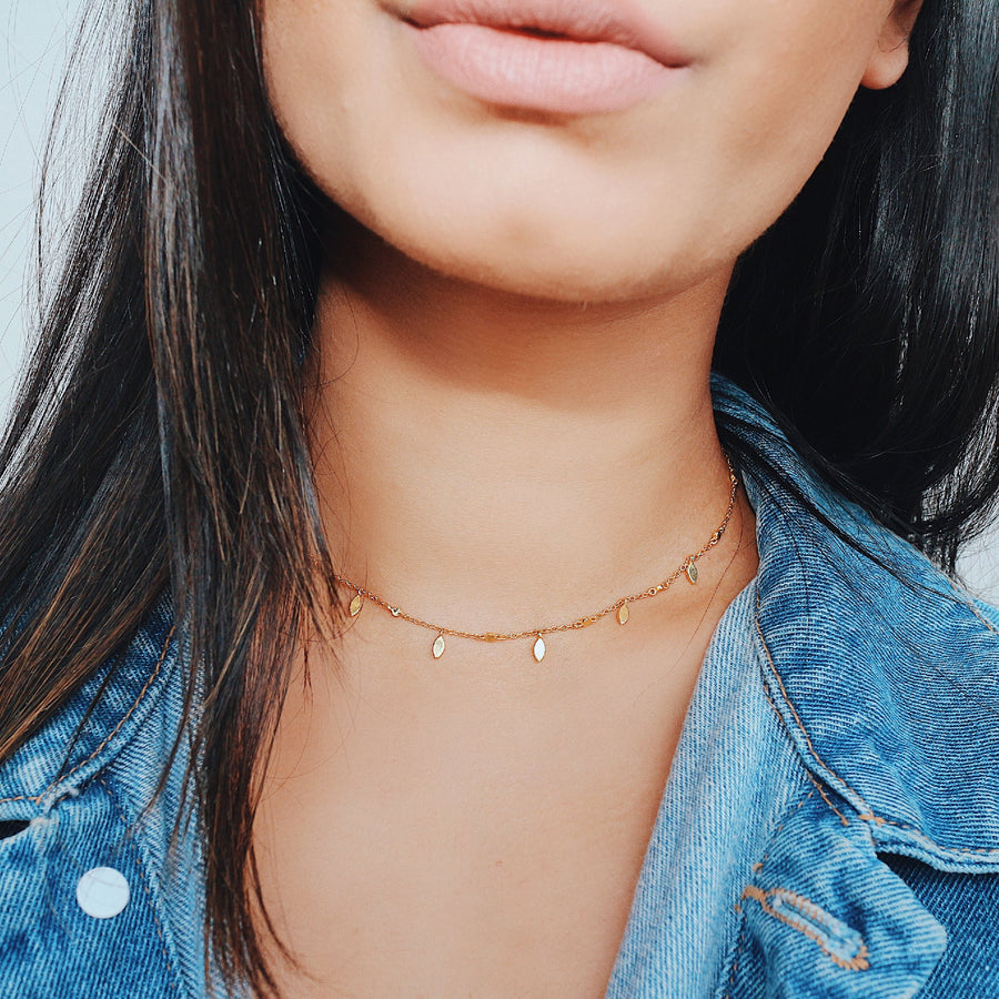 Gold over Sterling silver charm choker on model product photo
